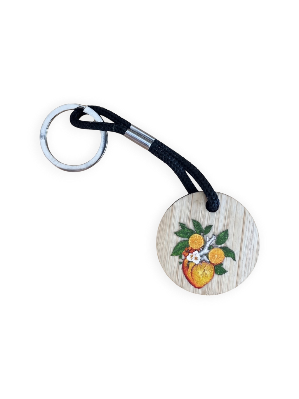 Llavero Siente Valencia Terreta – disco de madera con corazón botánico fondo blanco